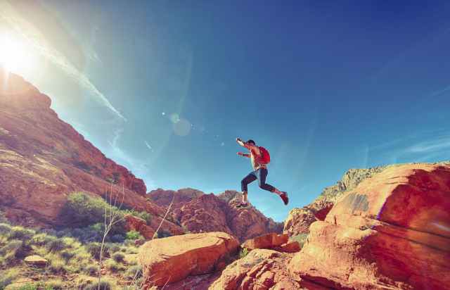 man person jumping desert