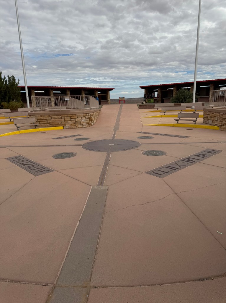 Four Corners Monument with plaques in the ground naming the fours states whose borders meet here. 