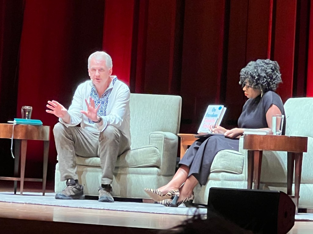 Photo of Timothy Snyder and Jodi-Ann Burey on stage at Benaroya Hall in Seattle.