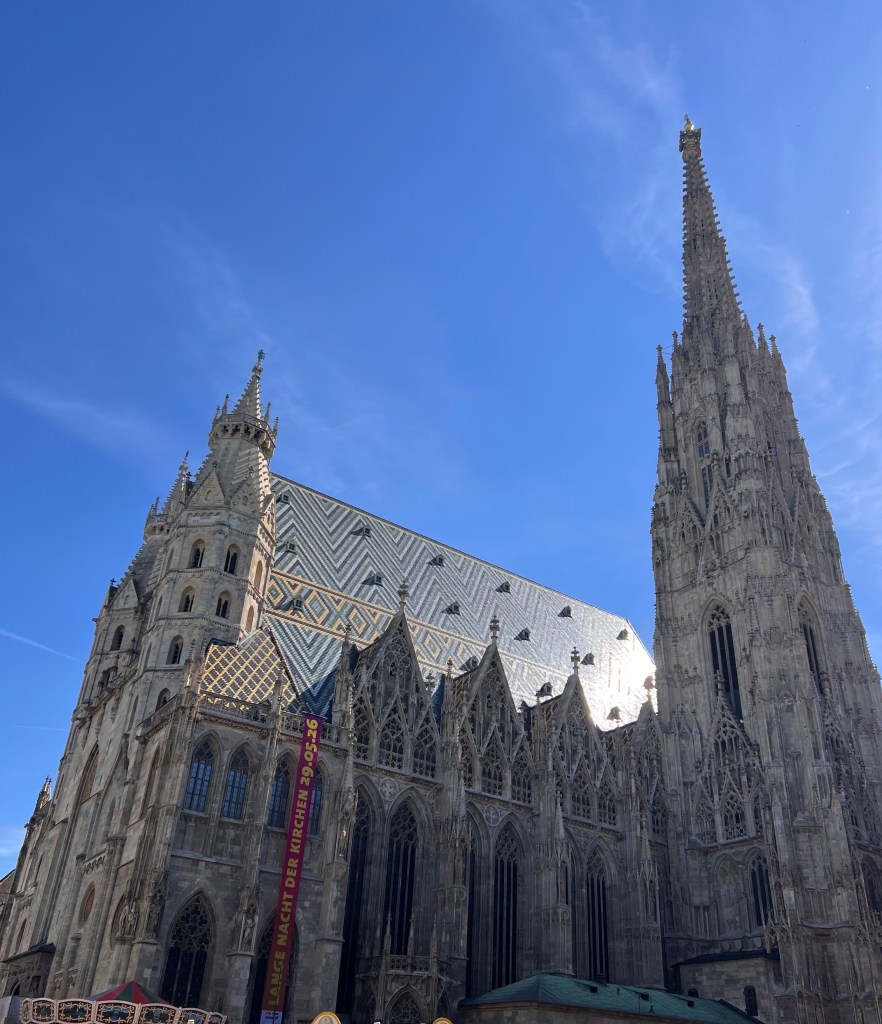 Photo of St. Stephen's Cathedral, Vienna, Austria highlighting its zigzag pattern of roof tiles.